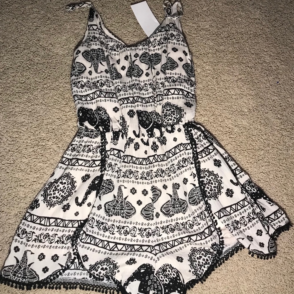Black and cream elephant romper